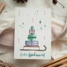 Weihnachtspostkarte „Geschenkeschlitten“